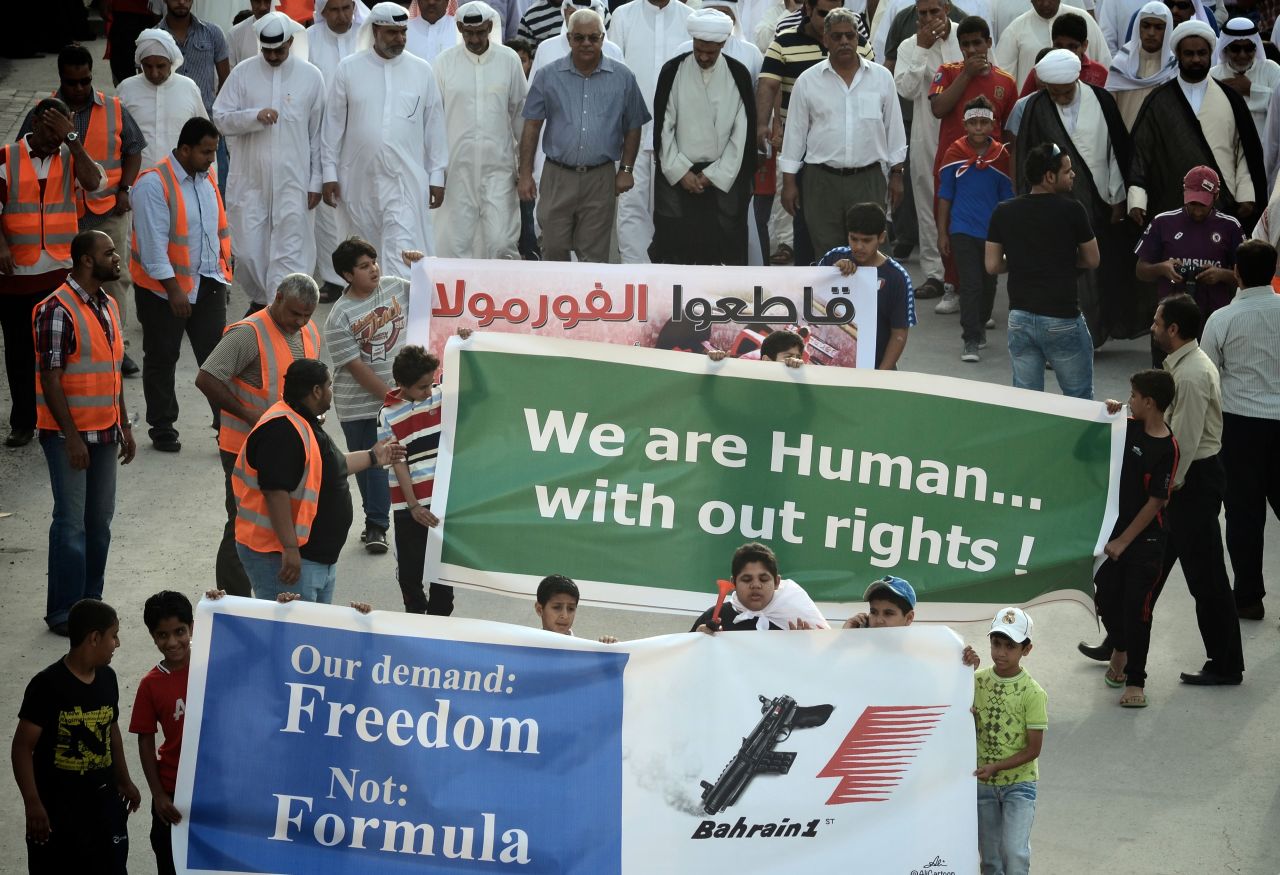 Bahraini Shiite Muslims in the town of Muharraq take part in a demonstration calling for the cancelation of Sunday's race. 