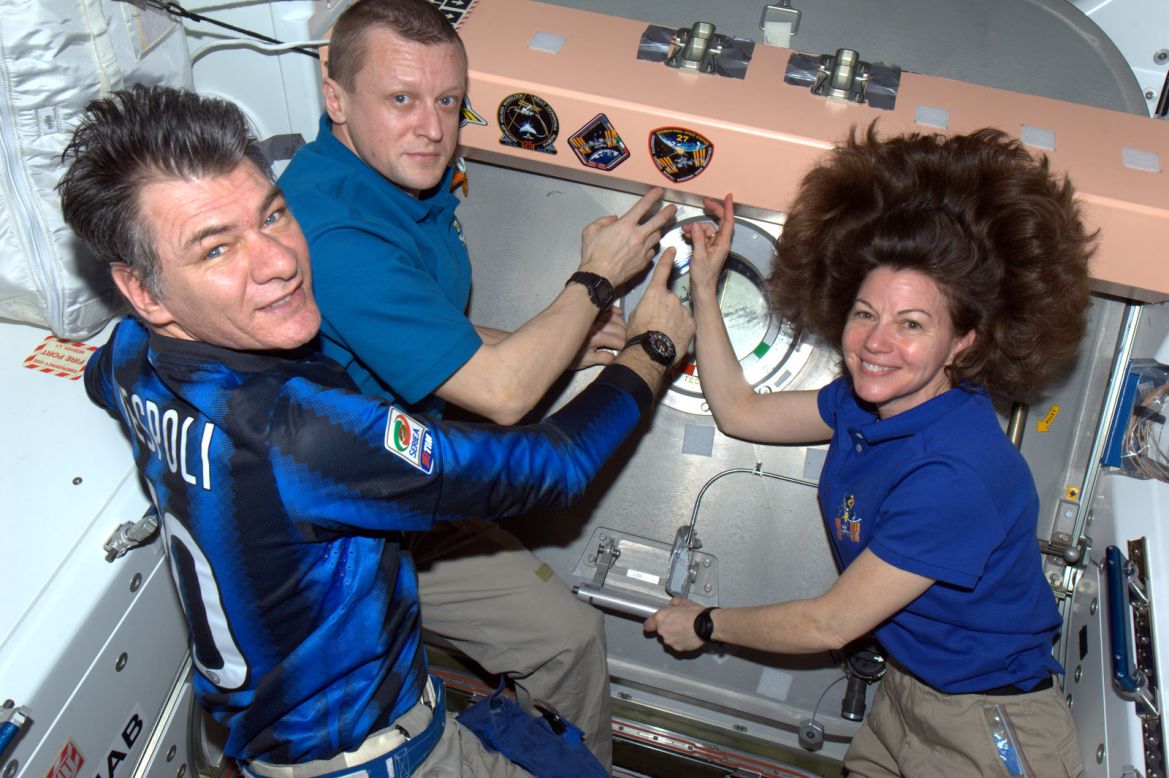 The 55-year-old Italian (seen here on the left) with fellow crew members, Russian cosmonaut Dmitry Kondratyev and NASA flight engineer, Cady Coleman. 
