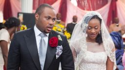 A new bride, wearing Kosibah, and her husband at a Nigerian wedding. nigerian weddings are becoming increasingly extravagant affairs.
