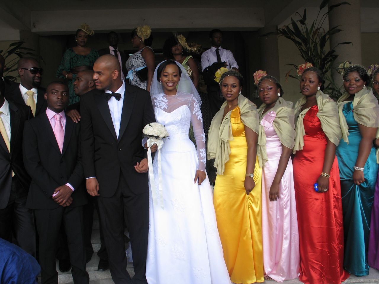A bride and the bridal party at a Nigerian wedding. Nigerian weddings feature two ceremonies: a traditional ceremony and a "white wedding."