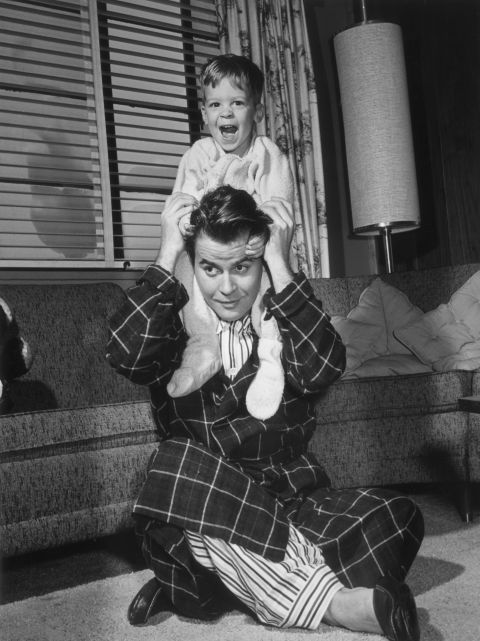 American TV personality Dick Clark plays with his son, circa 1955. Clark died Wednesday at age 82.