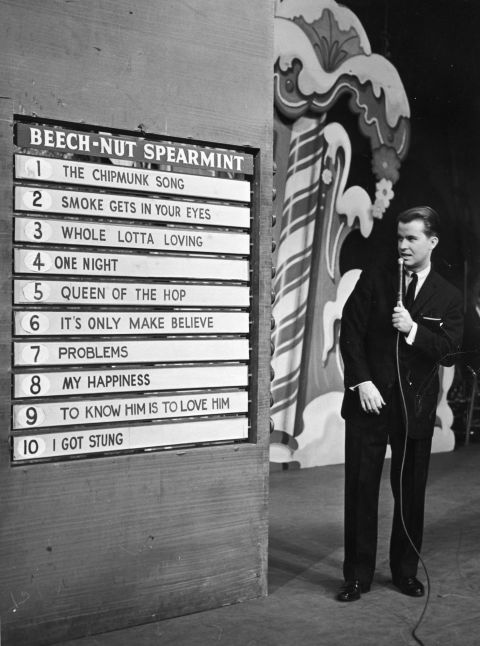 Clark announces the week's top 10 popular songs during an episode of the TV show, "American Bandstand," circa 1958. 