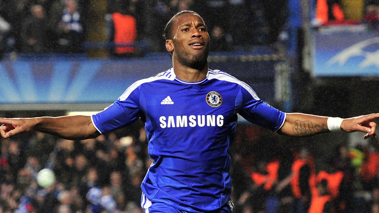 Chelsea's Didier Drogba celebrates after scoring with the last kick of the first half against Barcelona.