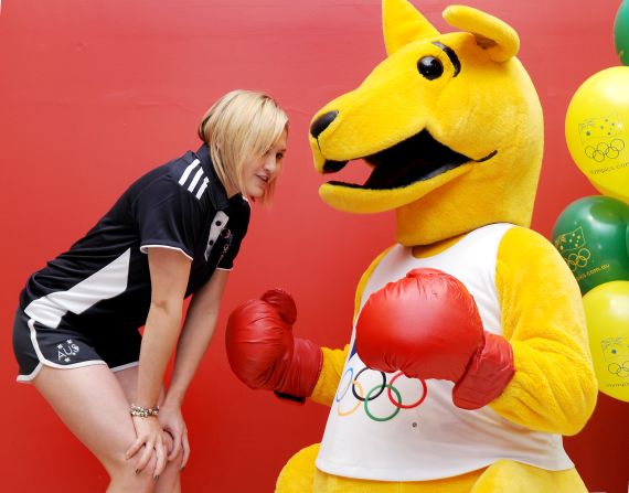 Melissa Wu, a diving silver medallist four years ago, poses with Australia's Boxing Kangaroo Olympic mascot as the 100-day landmark is celebrated in Sydney.