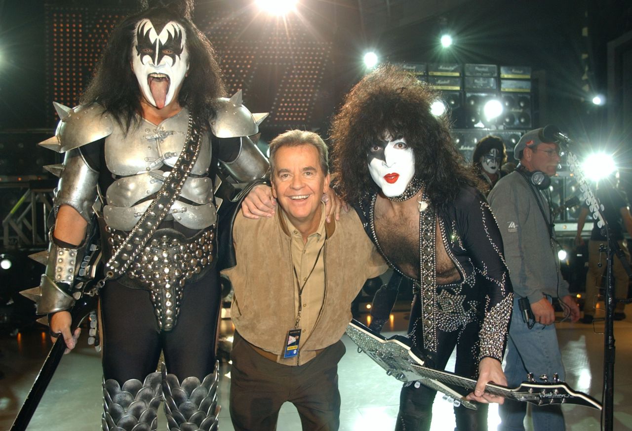 Clark poses with Gene Simmons and Paul Stanely during the taping of the 50th anniversary special of "American Bandstand."