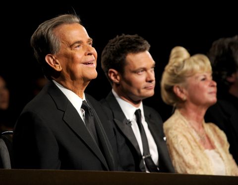 Clark, Ryan Seacrest and Kari Clark attend the Emmy Awards in 2010.