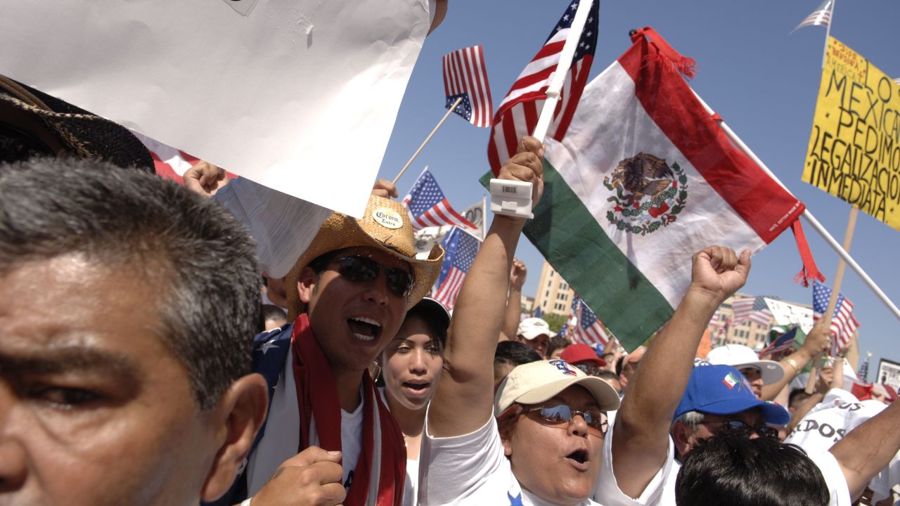 Protesters wave American flags and flags of their nations of origin at an immigration rally in Dallas in 2009. 