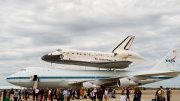 The final journey of space shuttle Discovery as it is strapped to the top of a Boeing 747 Shuttle Carrier Aircraft. Landing in Washington on April 17, 2012 to be placed in the Smithsonium's National Air and Space Museum. It signals the lack of public funding and the emergance of private firms entering space exploration.