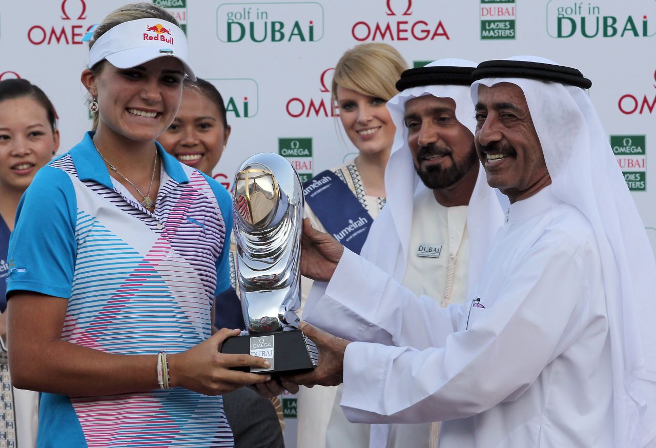 Thompson is the youngest player to win on the European Ladies' Tour. Here she receives her trophy at the Dubai Ladies Masters on December 17, 2011.
