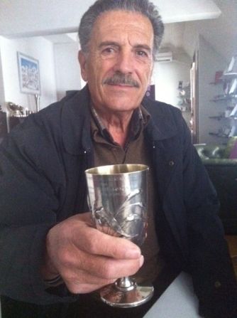 Spyros Louis, a retired civil servant and grandson of the great athlete, reluctantly decided to sell the cup in order to provide for his two children.