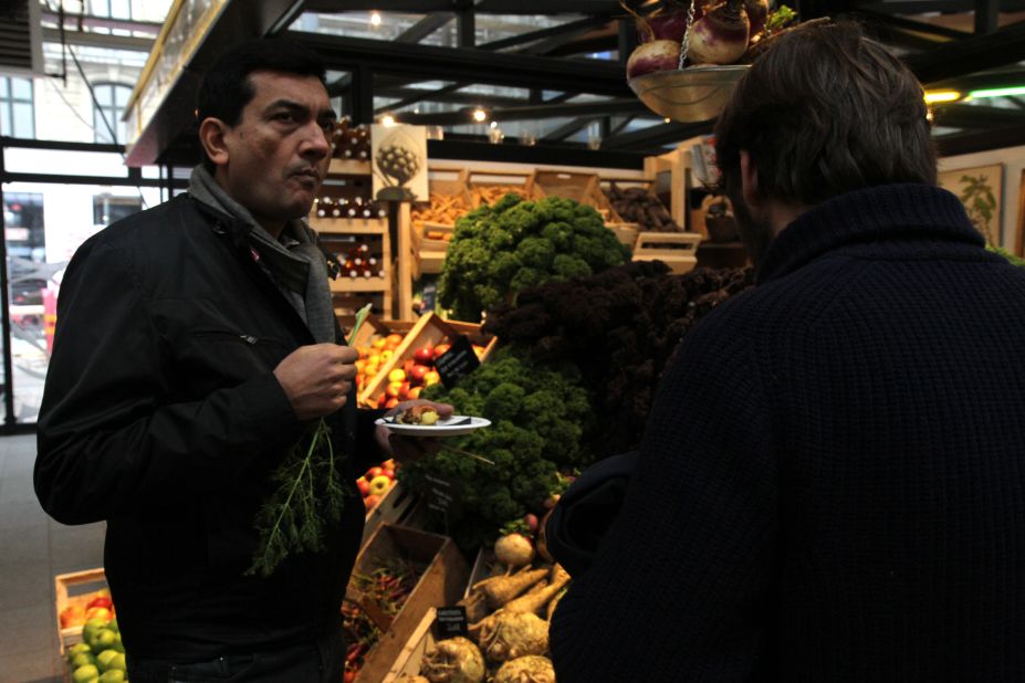 Back in the city, Kapoor nibbles on a variety of freshly plucked vegetables sold at one of Copenhagen's many street-side grocery stores.