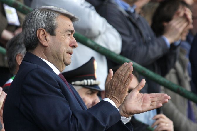 Livorno's president  Aldo Spinelli struggles to hold back tears as he salutes the hearse carrying Morosini's coffin at a memorial ceremony.