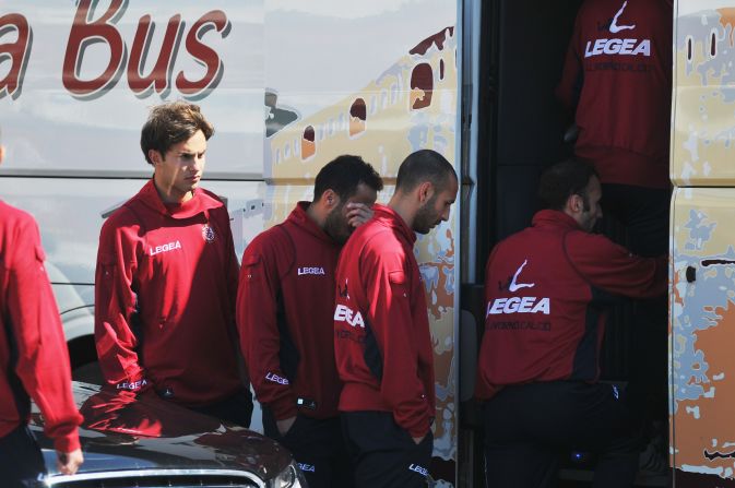 Morosini's Livorno teammates wipe away tears as they leave the ceremony at  Armando Picchi Stadium.