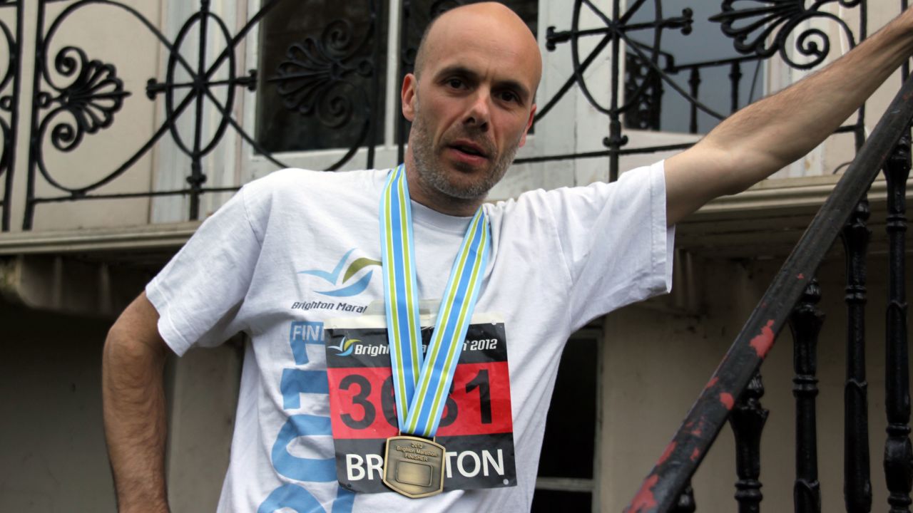 Peter Wilkinson proudly wears the medal he received for completing the 2012 Brighton Marathon.