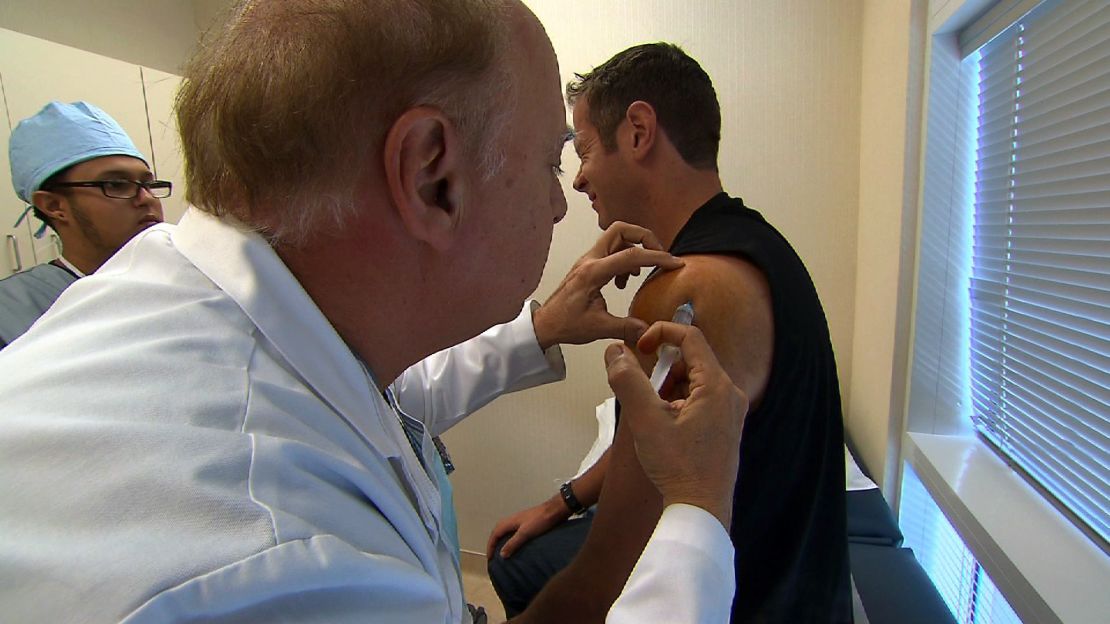 A doctor injects C.J. Nitkowski's stem cells into his injured shoulder