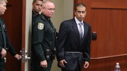 	SANFORD, FL- APRIL 20: George Zimmerman (R) is lead into a Seminole County courtroom for his bond hearing on April 20, 2012 in Sanford, Florida. Trayvon Martin was shot by George Zimmerman, a member of a neighborhood watch in Sanford, Florida, who has been charged with second degree murder in the shooting. Bail was set at $150,000 and Zimmerman and could be released from jail as he awaits trial as early as April 21. (Photo by Gary Green/The Orlando Sentinel-Pool/Getty Images)