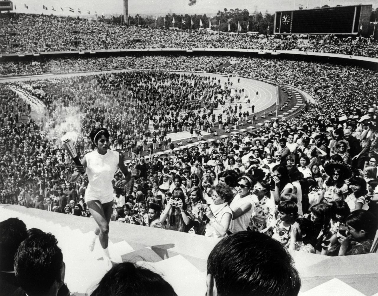 The 1968 Mexico Olympics began in controversial fashion. Revolution -- from Cuba to China -- was spreading across the world.