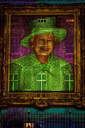 The Queen's image, made up of 200,000 self-portrait from children across the United Kingdom, is projected onto Buckingham Palace. 