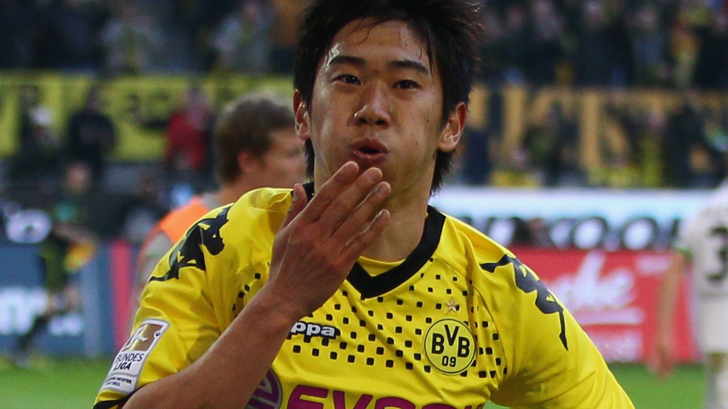 Shinji Kagawa celebrates after scoring Dortmund's second goal against Monchengladbach at Signal Iduna Park on Saturday.