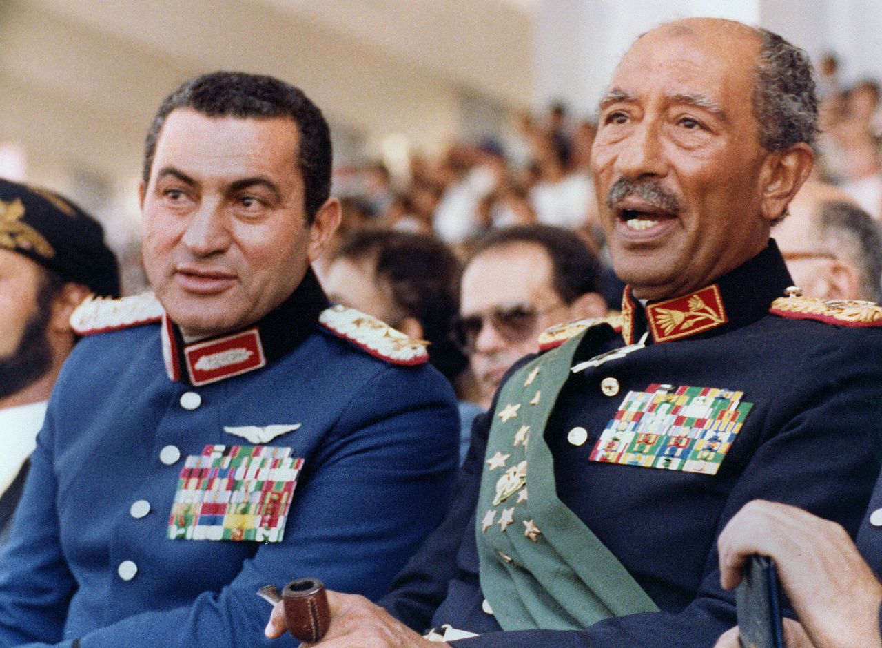 Then-Vice President Mubarak, left, joins President Anwar Sadat at a military parade on October 6, 1981, the day Islamic fundamentalists from within the army assassinated Sadat. Mubarak succeeded Sadat as Egypt's president, maintaining power for nearly three decades.