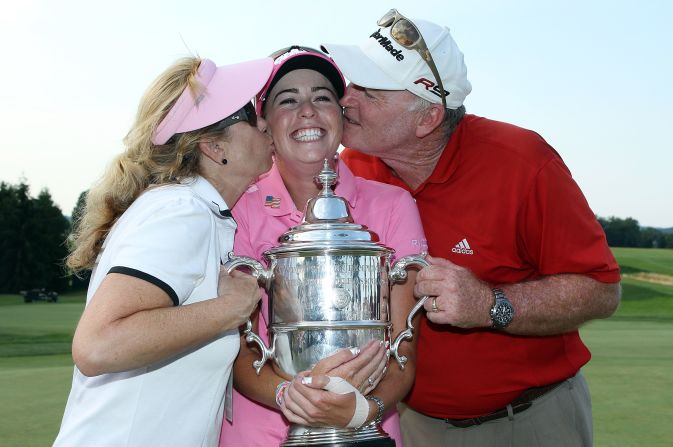 Creamer celebrates her 2010 U.S. Open win with her parents, Paul and Karen. Her dad was a Navy pilot for 22 years and will help in her new project to support the wives and families of soliders.