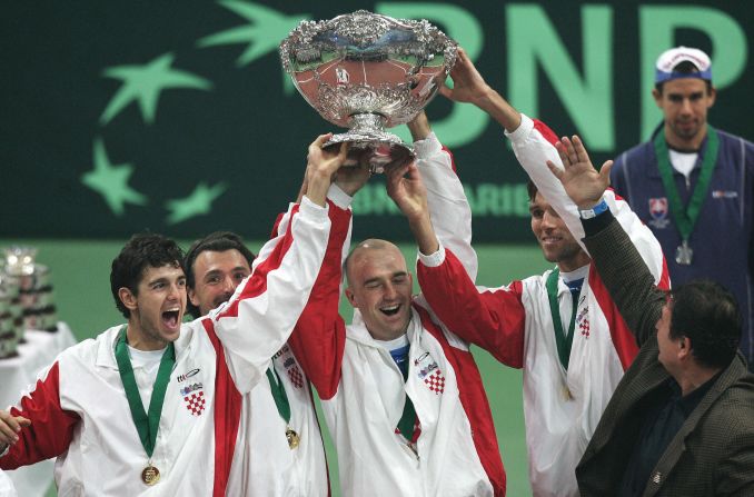 Croatia's team of (L-R) Mario Ancic, Goran Ivanisevic, Ljubicic, Ivo Karlovic hold the Davis Cup trophy aloft for the first and only time so far after defeating Slovakia 3-2 in Bratislava in 2005.