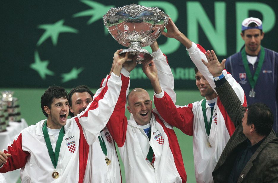 Croatia's team of (L-R) Mario Ancic, Goran Ivanisevic, Ljubicic, Ivo Karlovic hold the Davis Cup trophy aloft for the first and only time so far after defeating Slovakia 3-2 in Bratislava in 2005. 