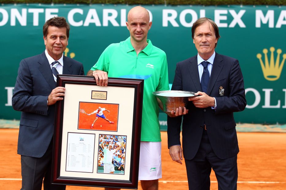 ATP chief Brad Drewett (L) and director Zeljiko Franulovic present the Croatian with a special trophy and gift to mark his retirement from tennis. Drewett described Ljubicic as "a true gentleman and ever popular amongst his peers." 