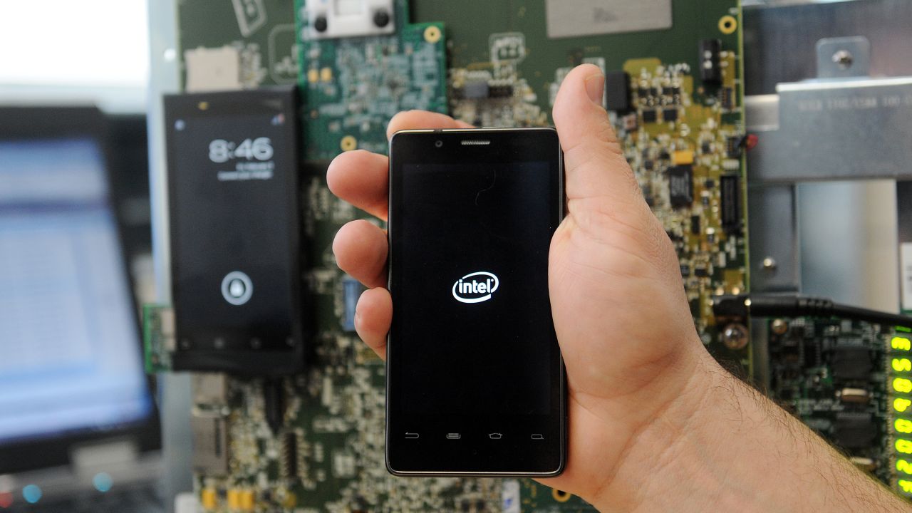 A worker shows a smartphone on March 2 in Toulouse at the Intel's smartphones' research center.
