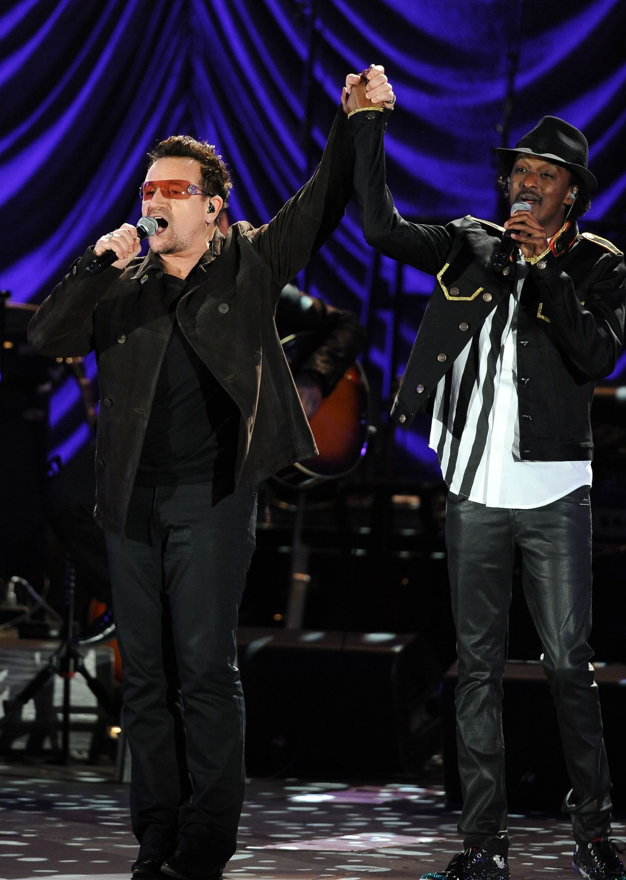 U2 singer Bono and K'naan perform at the Clinton Foundation's Decade of Difference concert on October 15, 2011 at the Hollywood Bowl in California.