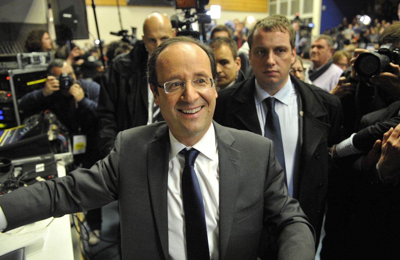 The Socialist Party's Francois Hollande leaves the election rally following the announcement of the estimated results of the first round of the presidential election. 