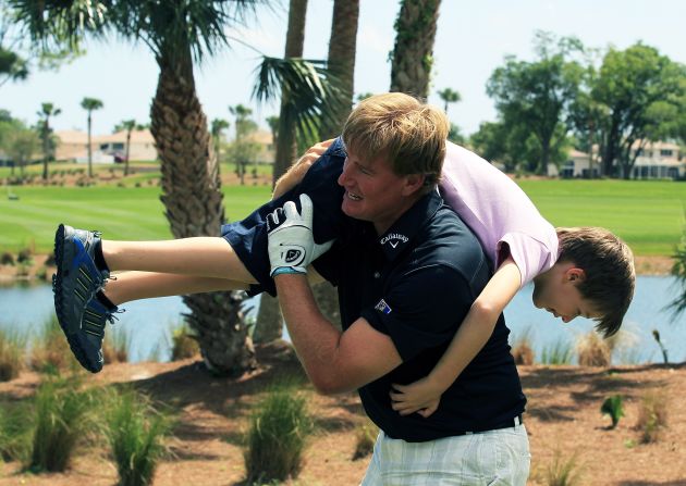 The former world No. 1swings his son Ben over his shoulder during the fourth annual Els for Autism Pro-Am charity golf tournament, held in March 2012.