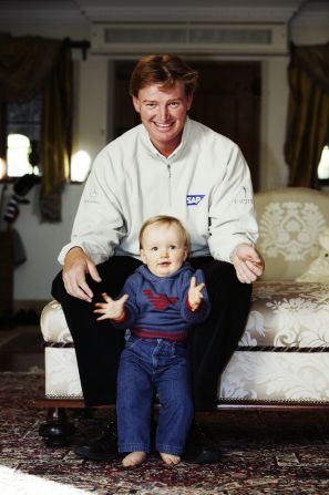 Now nine, the youngster still struggles to speak and attends a specialist school in Florida. He is pictured here with his father in their former home in England in 2003.