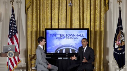 Twitter co-founder Jack Dorsey listens while President Barack Obama speaks during an online Twitter town hall meeting in 2011.