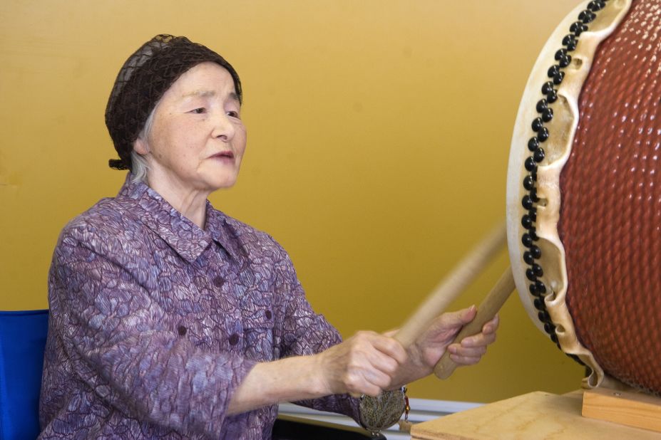 In Japan, this unidentified woman with Alzheimer's enjoyed therapy through music. Joining a drum circle, she became caught up in an intense rhythmic response.