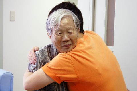 Also in Japan, an aide in a Kyoto group home embraced this unidentified resident living with Alzheimer's.
