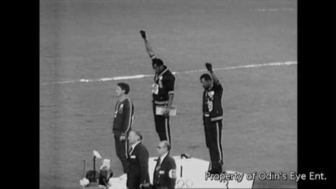 Peter Norman, left, stands in solidarity during the podium protest by Smith and Carlos.