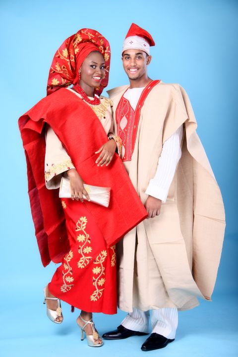 Models wear traditional Nigerian attire known as "aso oke" for a photo shoot for Wed Magazine. Aso-oke is hand-woven fabric worn at weddings, funerals and other formal occasions.