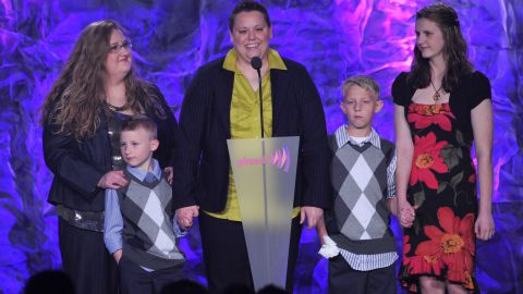 Jennifer Tyrrell, center, and Alicia Burns, left, with children speak onstage at the 23rd Annual GLAAD Media Awards.