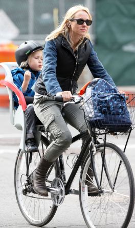 Naomi Watts rides a bike with her son in New York City.