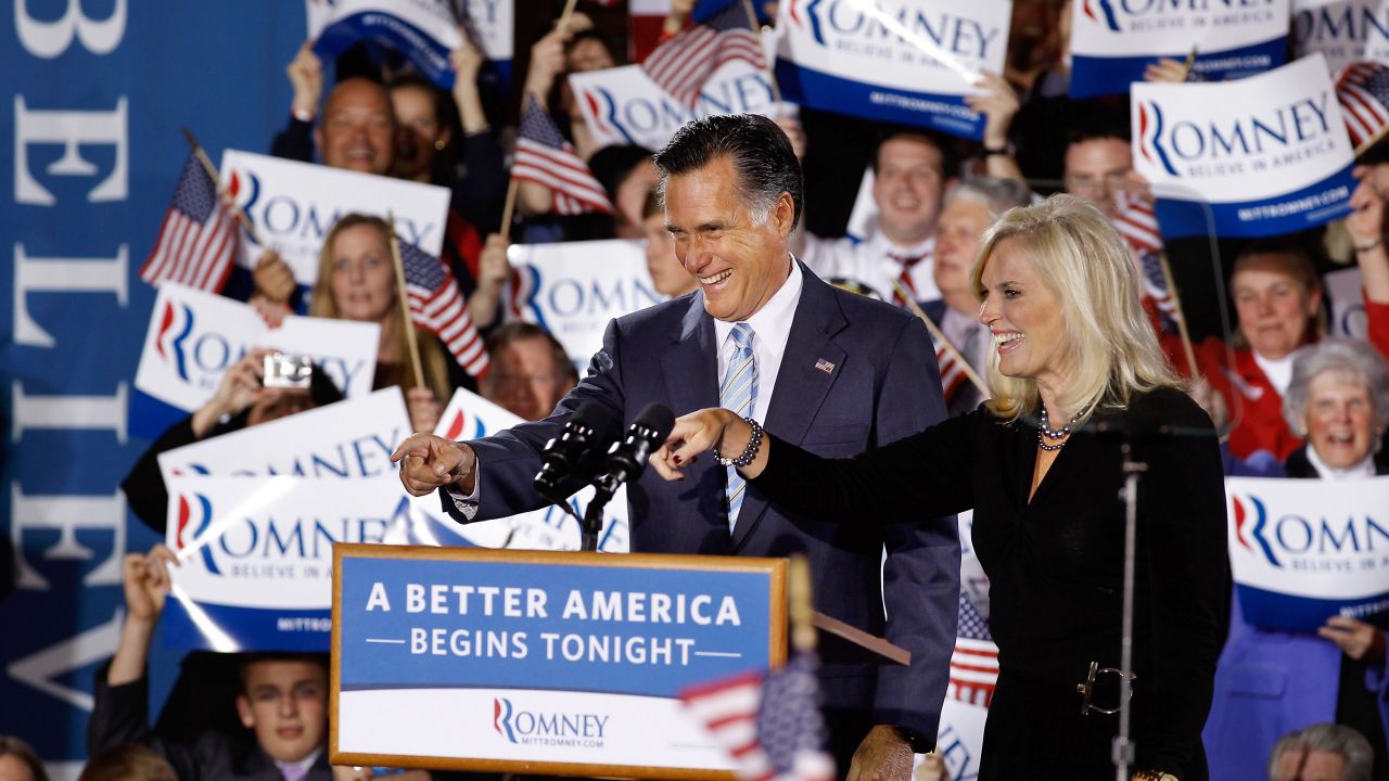Mitt Romney and his wife, Ann, celebrate Tuesday's primary sweep with supporters in New Hampshire.