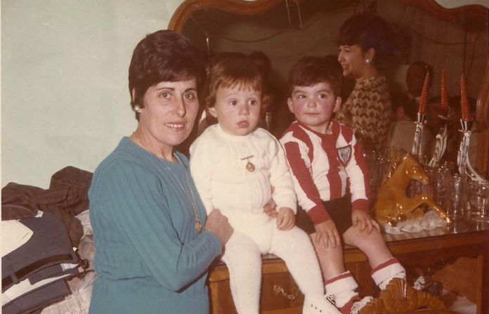 Juan Luis Moreno (center) with his mother and childhood friend Antonio Barroso, another child who was told he had been illegally adopted.