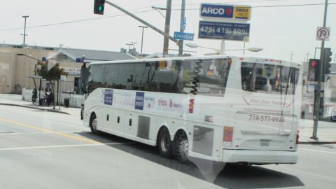 A bus winds its way through south Los Angeles during Operation Hope's economic empowerment tour.