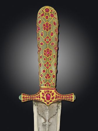 This 16th-century Ottoman sword, decorated with gold and inlaid with precious stones, was one of a number of ornate weapons to go under the hammer at Christie's.