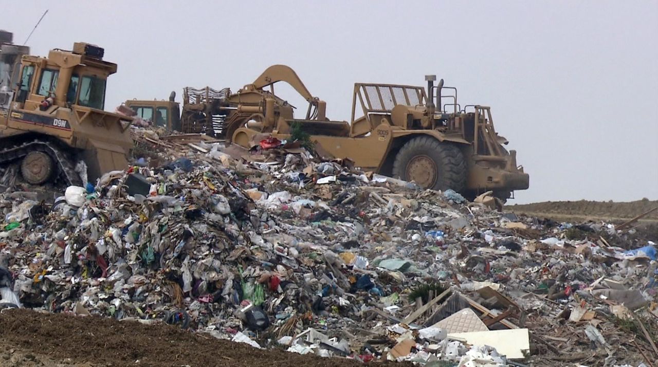 Compacting trucks assemble the latest delivery to L.A.'s Puente Hills Landfill, the largest rubbish dump in America. Despite surface appearances, Puente Hills is considered one of the most state-of-the-art landfills in the world. Some aren't so well maintained.