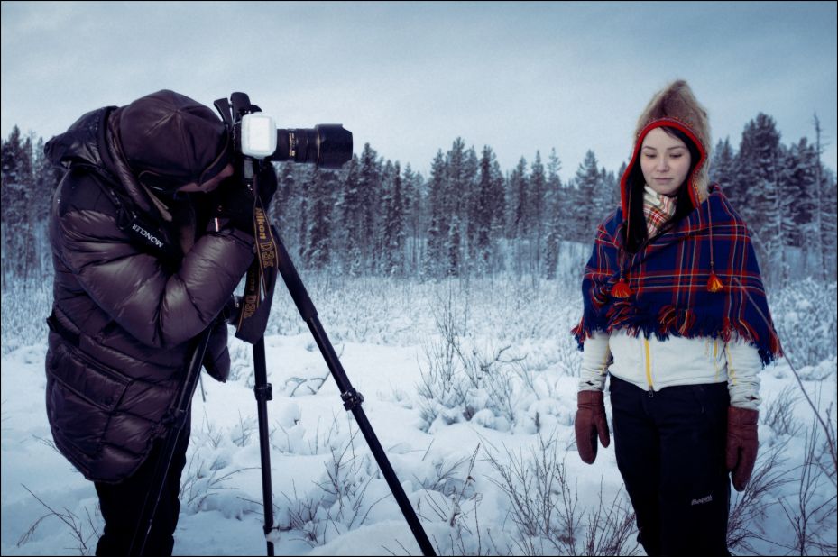 Moukarzel takes a picture of a local Sami girl, against the dark, ethereal backdrop of the Lulea forest. 