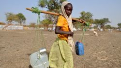 A young girl collects water at the Jamam Refugee Camp in South Sudan