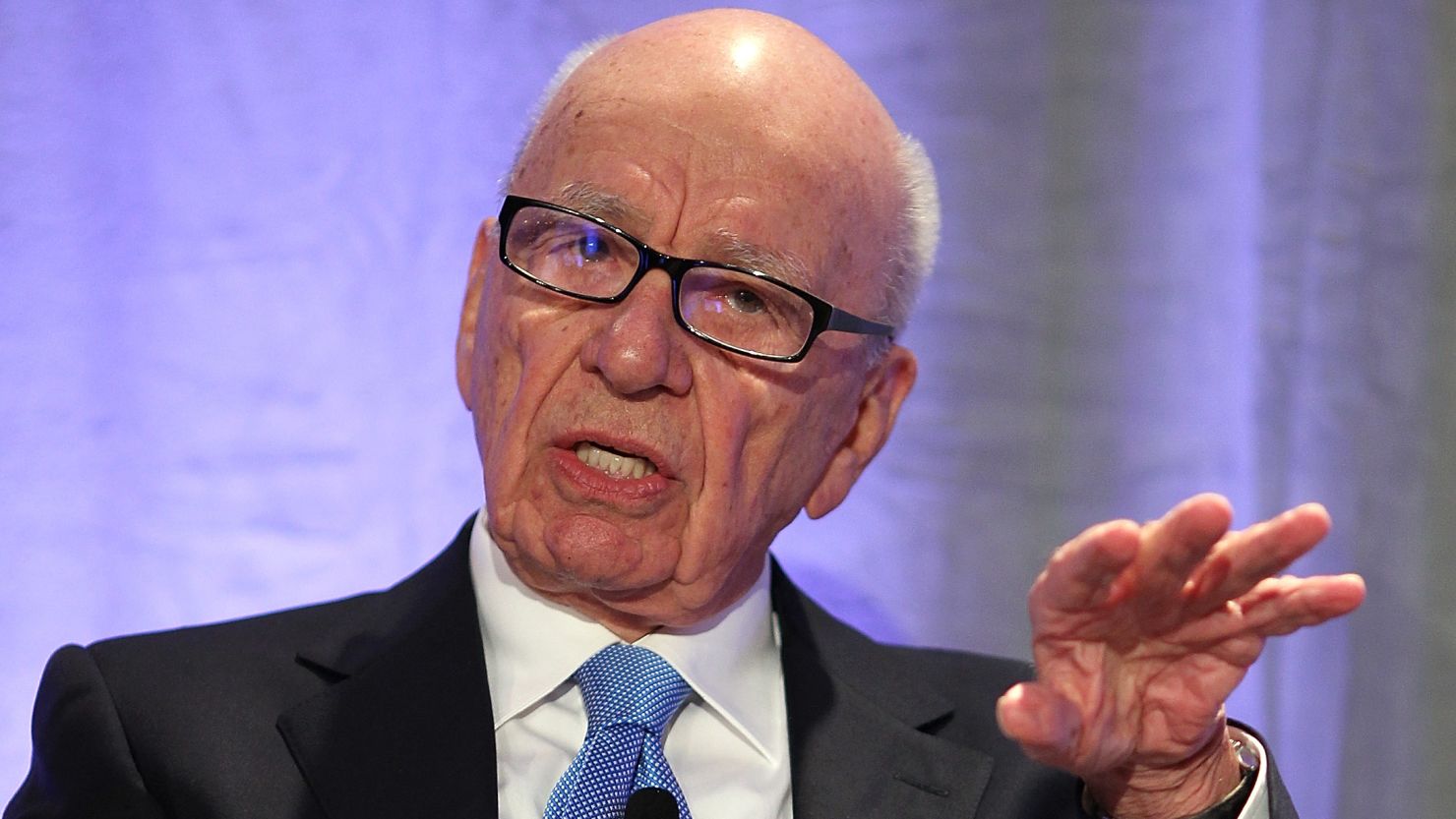 Rupert Murdoch claimed he had been "humbled" by the phone-hacking scandal, which led him to close the News Of The World.