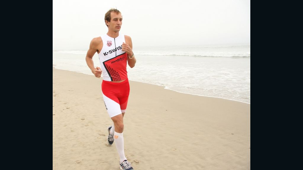 Triathlete Aaron Scheidies, 30, is suing over a rule that makes vison-impaired runners wear blackout glasses.