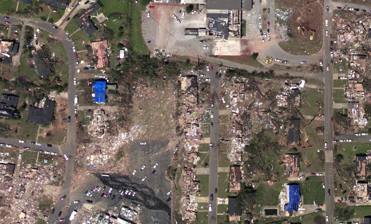 And this photo, taken by the National Oceanic and Atmospheric Administration's National Geodetic Survey just days after the tornado, shows the damage to the same neighborhood.